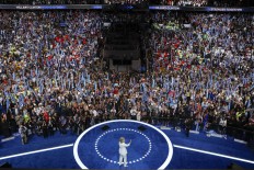 Democratic presidential nominee Hillary Clinton takes the stage to make her acceptance speech during the final day of the Democratic National Convention in Philadelphia , Thursday, July 28, 2016. AP Photo/Paul Sancya
