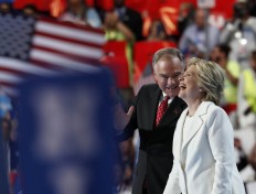 Democratic presidential nominee Hillary Clinton shares a laugh with Democratic vice presidential nominee Sen. Tim Kaine, D-Va., on stage during the final day of the Democratic National Convention in Philadelphia , Thursday, July 28, 2016. AP Photo/Paul Sancya
