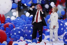 Democratic presidential nominee Hillary Clinton and her running mate Democratic vice presidential nominee Sen. Tim Kaine, D-Va., celebrate in a sea of falling balloons during the final day of the Democratic National Convention in Philadelphia , Thursday, July 28, 2016. AP Photo/J. Scott Applewhite