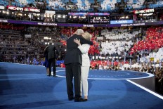 Former President Bill Clinton hugs Democratic presidential candidate Hillary Clinton, right, as he joins her on stage during the fourth day session of the Democratic National Convention in Philadelphia, Thursday, July 28, 2016. AP Photo/Andrew Harnik
