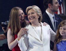 Chelsea Clinton shares a moment on stage with her mother Democratic presidential nominee Hillary Clinton during the final day of the Democratic National Convention in Philadelphia , Thursday, July 28, 2016. AP Photo/Paul Sancya
