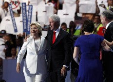 Democratic presidential nominee Hillary Clinton and husband Former President Bill Clinton walk on stage after her acceptance speech during the final day of the Democratic National Convention in Philadelphia , Thursday, July 28, 2016. AP Photo/Paul Sancya