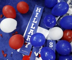A poster for Democratic presidential nominee Hillary Clinton is shown on the floor with balloons after the Democratic National Convention in Philadelphia, Friday, July 29, 2016. AP Photo/Paul Sancya
