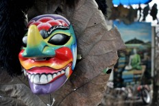 Artwork is displayed at the Five Mountain Festival, such as this wooden mask. JP/ Albertus Magnus Kus Hendratmo