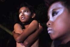 Ganjel Lumbung dancers hug themselves against the cold as they wait for their turn to perform. JP/ Albertus Magnus Kus Hendratmo
