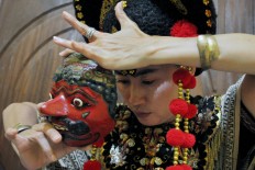 Nani, a Losari mask dancer, prepares to perform at the festival. JP/ Albertus Magnus Kus Hendratmo