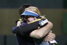 Games begin in full, with US teen on target for 1st gold 