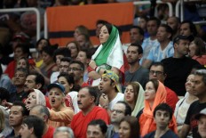 Banned at home, Iranian woman attends first volleyball game