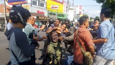 Papuan student files pretrial motion challenging suspect status