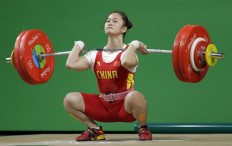 Deng lifts gold with record against field depleted by doping 