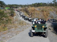 Tour De Merapi participants ride jeeps through Cangkringan to the areas worst affected by Mt. Merapi’s eruptions, which have been made into tourist sites. JP/ Agus Maryono