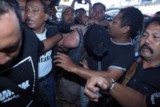 Australian, Briton named suspects in policeman murder