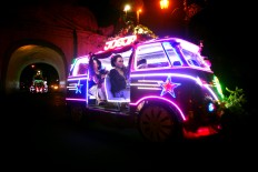 The team of each decorated pedal car wears its own special attire during the carnival. JP/Aditya Sagita