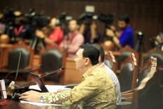 Ahok asks court  to scrap absence rule