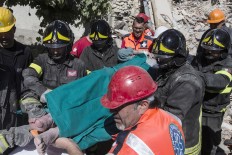 An injured man is carried on a stretcher by rescuers following an earthquake in Accumoli, central Italy, Wednesday, Aug. 24, 2016. The magnitude 6 quake struck at 3:36 a.m. [0136 GMT] and was felt across a broad swath of central Italy, including 
Rome, where residents felt a long swaying followed by aftershocks. The temblor shook the Lazio region and Umbria and Le Marche on the Adriatic coast. Angelo Carconi/ANSA via AP