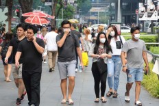 Masks fly off shop shelves as smoke shrouds Singapore