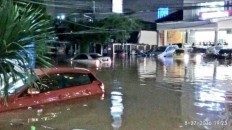Cars left behind by owners in flooded Kemang