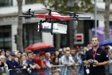 Drones swoop down Paris' Champs-Elysees in festival 
