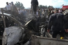 Wave of IS-claimed bombings in Syria kill at least 48 
