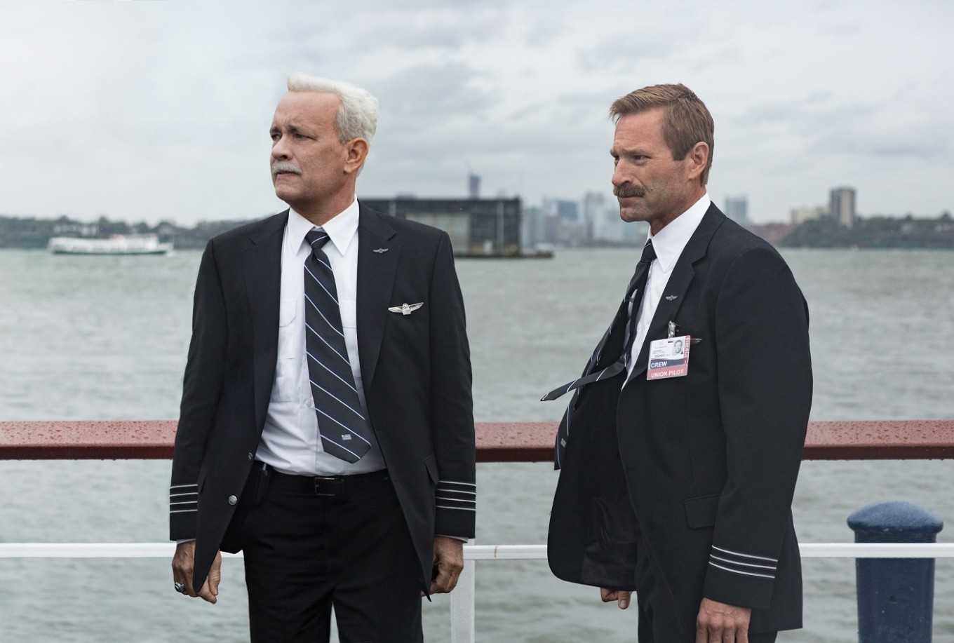 This image released by Warner Bros. Pictures shows Tom Hanks, left, and Aaron Eckhart in a scene from "Sully." The movie opens in U.S. theaters on Friday.