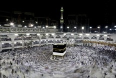 In this Wednesday, Sept. 7, 2016 file photo, Muslim pilgrims circle the Kaaba, Islam's holiest shrine, at the Grand Mosque in the Muslim holy city of Mecca, Saudi Arabia. Muslim pilgrims have begun arriving at the holiest sites in Islam ahead of the annual hajj pilgrimage in Saudi Arabia, with some weeping with their hands outstretched for a fleeting touch of the Kaaba. The cube-shaped shrine, at the center of Mecca's Grand Mosque, is the site the world’s 1.6 billion Muslims pray toward five times a day. AP Photo/Nariman El-Mofty