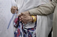 An elderly Indian woman leads her husband as they circle the Kaaba, Islam's holiest shrine, at the Grand Mosque in the Muslim holy city of Mecca, Saudi Arabia, Thursday, Sept. 8, 2016. Muslim pilgrims have begun arriving at the holiest sites in Islam ahead of the annual hajj pilgrimage in Saudi Arabia, with some weeping with their hands outstretched for a fleeting touch of the Kaaba. The cube-shaped shrine, at the center of Mecca's Grand Mosque, is the site the world’s 1.6 billion Muslims pray toward five times a day. AP Photo/Nariman El-Mofty