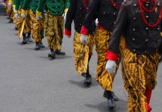 Surakarta Palace soldiers wearing official attire march toward the palace. JP/Ganug Nugroho Adi