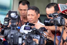 Former Pelindo II president director RJ Lino leaves the Corruption Eradication Commission (KPK) building after undergoing questioning on Feb. 5, 2016.