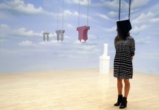 A woman looks towards part of an artwork called 'Lichen! Libido! [London!] Chastity!' by Anthea Hamilton, one of the four artists shortlisted for the Turner Prize 2016, as it is displayed at the Tate Britain gallery in London, Monday, Sept. 26, 2016. The Turner Prize aims to promote public debate around new developments in contemporary British art. AP Photo/Kirsty Wigglesworth