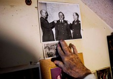 Memorabilia decorates a wall in the home of Frank Gleason, 96, a retired colonel with the Office of Strategic Services, in Atlanta, Wednesday, Sept. 28, 2016. Legislation to recognize the contributions of a group of World War II spies is hung up in Congress. Some 75 years ago, the OSS carried out missions behind enemy lines in Nazi Germany and the Pacific theatre. Gleason's group was tasked with halting the Japanese advance into China. Gleason and his comrades did this by detonating bridges, railroad tracks and anything else. 'We just blew stuff up left and right,' said Gleason. AP Photo/David Goldman