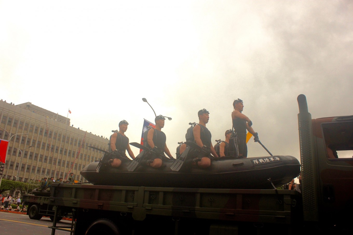 Personnel often deployed in disaster relief efforts participate in a parade during Taiwan’s 105th anniversary in Taipei on Monday.
