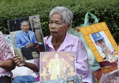 Thai stocks tumble, prince rushes home amid king worries 