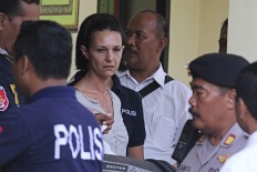 Couple await trial in alleged Bali cop murder case