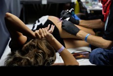 In this picture taken on Sunday, Oct. 16, 2016, a woman gets a tattoo during the International Tattoo Convention Bucharest 2016 in Bucharest, Romania. AP Photo/Vadim Ghirda

