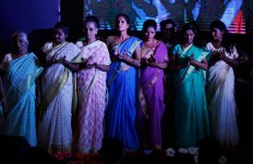 Indian Hindu widows applaud as they stand on stage during a fashion show in New Delhi, India, Saturday, Oct. 15, 2016. In most of India, millions of Hindu widows are expected to live out their days in quiet worship, dressed only in white. They are typically barred from all religious festivities because their very presence is considered inauspicious. They are now breaking age-old traditions of staying aloof by actively participating in Hindu festivals like Holi and Diwali. On Saturday, they went a step further recently, participating in a fashion show. AP Photo/Altaf Qadri