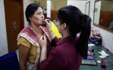 A makeup artist gets an Indian Hindu widow ready for a fashion show in New Delhi, India, Saturday, Oct. 15, 2016. Until recently, Indian widows were expected to follow the sociocultural codes of a patriarchal Hindu society that demands a woman lead a life of asceticism after a husband’s death. Their lives appear to be changing for better with women's groups and Indian aid organizations taking interest in their welfare. AP Photo/Altaf Qadri