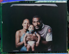In this Sept. 29, 2016 photo made from a negative recovered from instant film, Diana Felix and Carlos Alberto Dias, pose with their son, Ezequiel, who was born with microcephaly, one of many serious medical problems that can be caused by congenital Zika syndrome, in Recife, Pernambuco state, Brazil. Dias stopped working to help Felix care for their four children. Sometimes he accompanies her to Ezequiel's therapy sessions and medical appointments, which can be as often as five times a week. AP Photo/Felipe Dana
