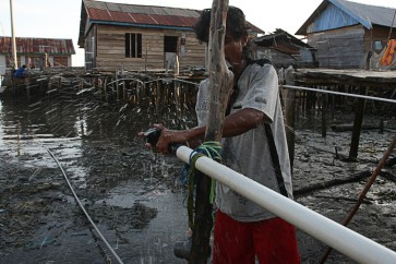Against poverty: A resident repairs a water pipe on Oct.17, 2025, in Sama Jaya village, Konawe, Southeast Sulawesi. The Health Ministry has intended to give people greater access to basic health care service facilities and to increase the development of clean water and sanitation infrastructure