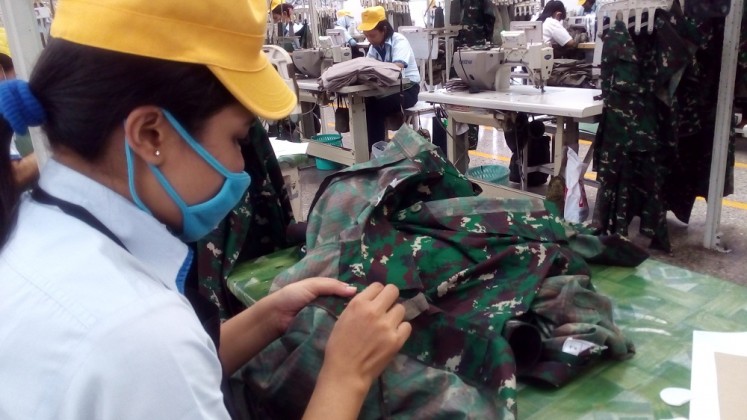 Workers produce military uniforms at a factory of PT Sri Rezeki Isman (Sritex) in Sukoharjo, Central Java, in October 2016.