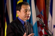 In this Feb. 15, 2009, file photo, Japanese novelist Haruki Murakamimakes a speech after receiving the Jerusalem's award during the International Book Fair in Jerusalem. Murakami warned against excluding outsiders and rewriting history as he accepted the Hans Christian Andersen Literature Award. Murakami spoke on Sunday, Oct. 30, 2016, in Odense, Denmark, the birthplace of the 19th century fairy tale writer. His speech titled "The Meaning of Shadows" cited Andersen's dark fantasy, "The Shadow."