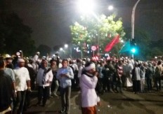 Police fire tear gas at protesters, two police trucks burned 