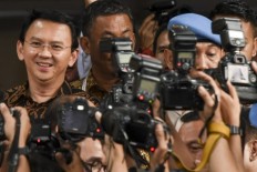 Ahok disappointed with ‘barbaric’ measures to force his withdrawal