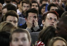 Supporters react to election results during Democratic presidential nominee Hillary Clinton's election night rally in the Jacob Javits Center glass enclosed lobby in New York, Tuesday, Nov. 8, 2016. AP Photo/Frank Franklin II