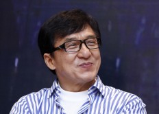 In this Dec. 18, 2013, file photo, Hong Kong actor Jackie Chan smiles during a news conference to promote his new film "Police Story 2013," in Kuala Lumpur, Malaysia. 