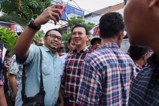 Despite suspect status, Ahok remains front-runner
