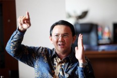 Ahok proud to be suspect in non-corruption case