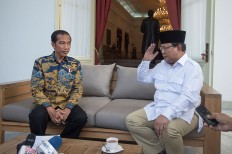 Prabowo visits Jokowi, offers help after Ahok named suspect
