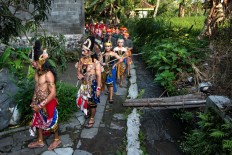 All participants of the arts performance walk around Tutup Ngisor village in the foothills of Mount Merapi in Central Java during a Suro ritual.
JP/Tarko Sudiarno