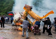The burning of an effigy of a wild hog serves to drive away bad luck.  JP/ Tarko Sudiarno