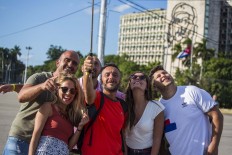 In Cuba, tourists find historic moment and limited options 